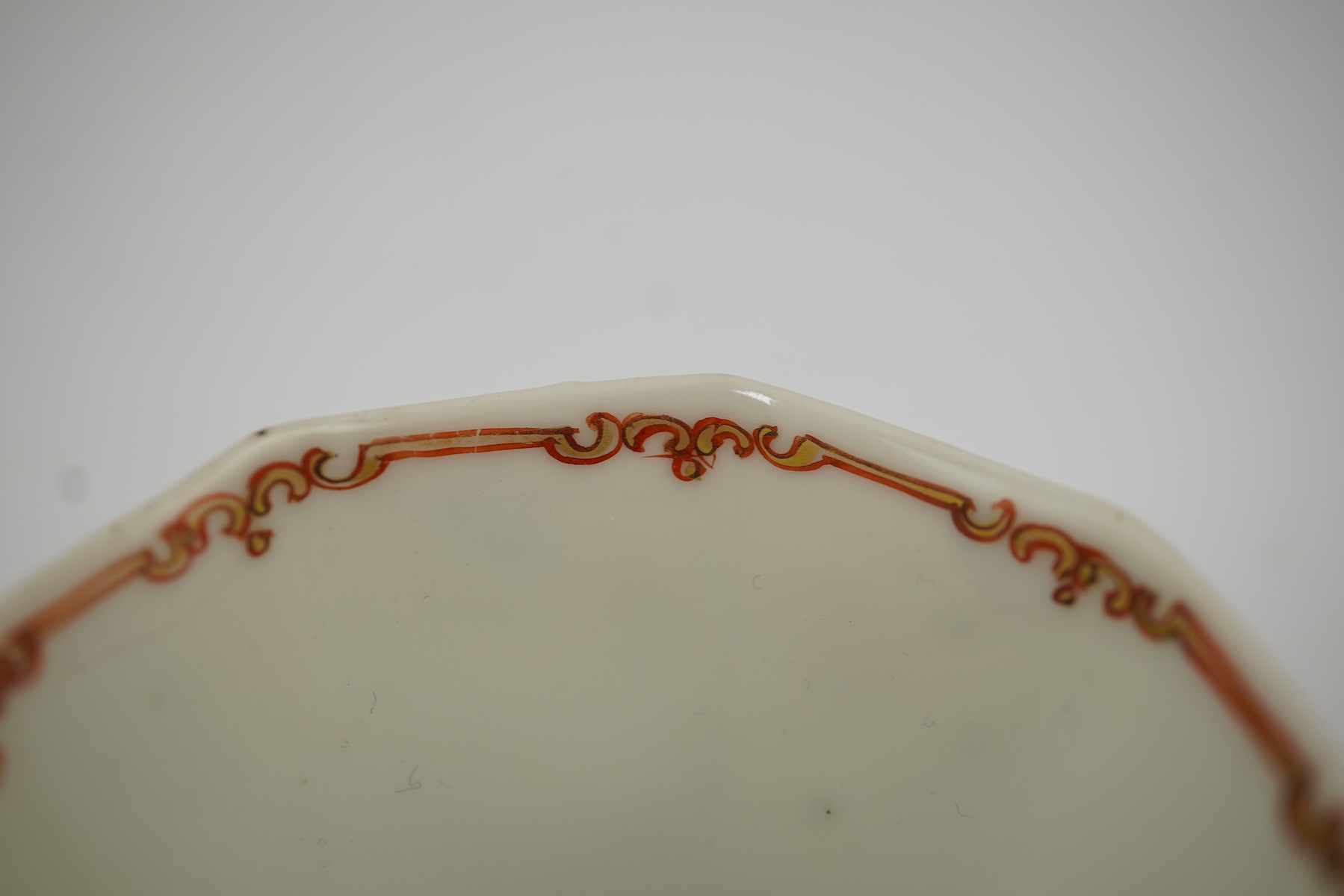 Two Chinese semi-eggshell porcelain hexagonal saucers and a similar cup, Yongzheng/Qianlong period